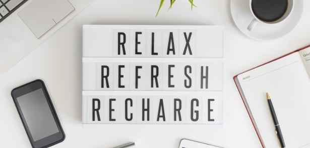 relax refresh recharge sign with phone and day planner