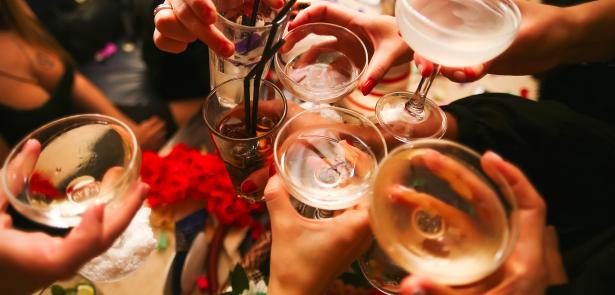 group of people clinking glasses