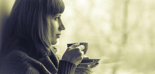 woman looking out window