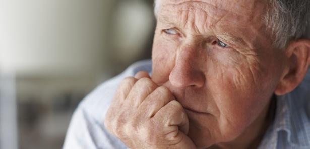 sad senior staring out the window