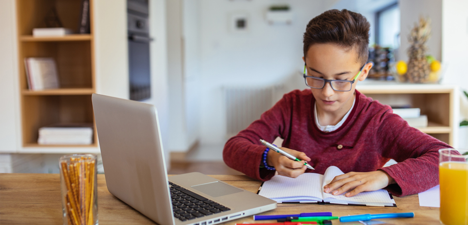 child working on homework for child distance learning blog