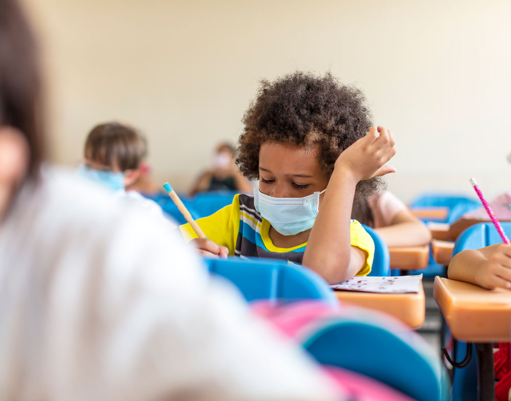 child at school in mask